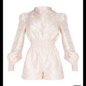 Brand New with tags. Pretty little thing romper